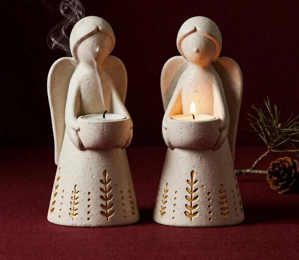 Cream ceramic angel tealight holders with golden botanical detailing