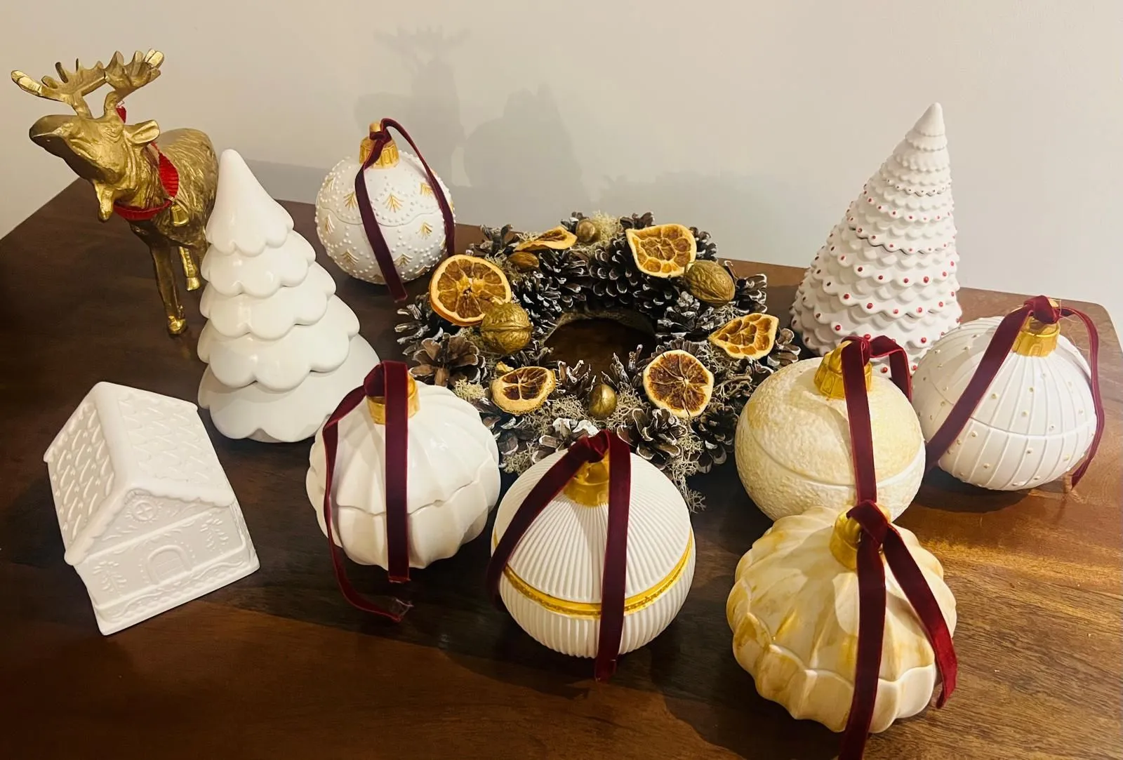 Roccoco Home's handmade festive candle and ornament collection arranged together