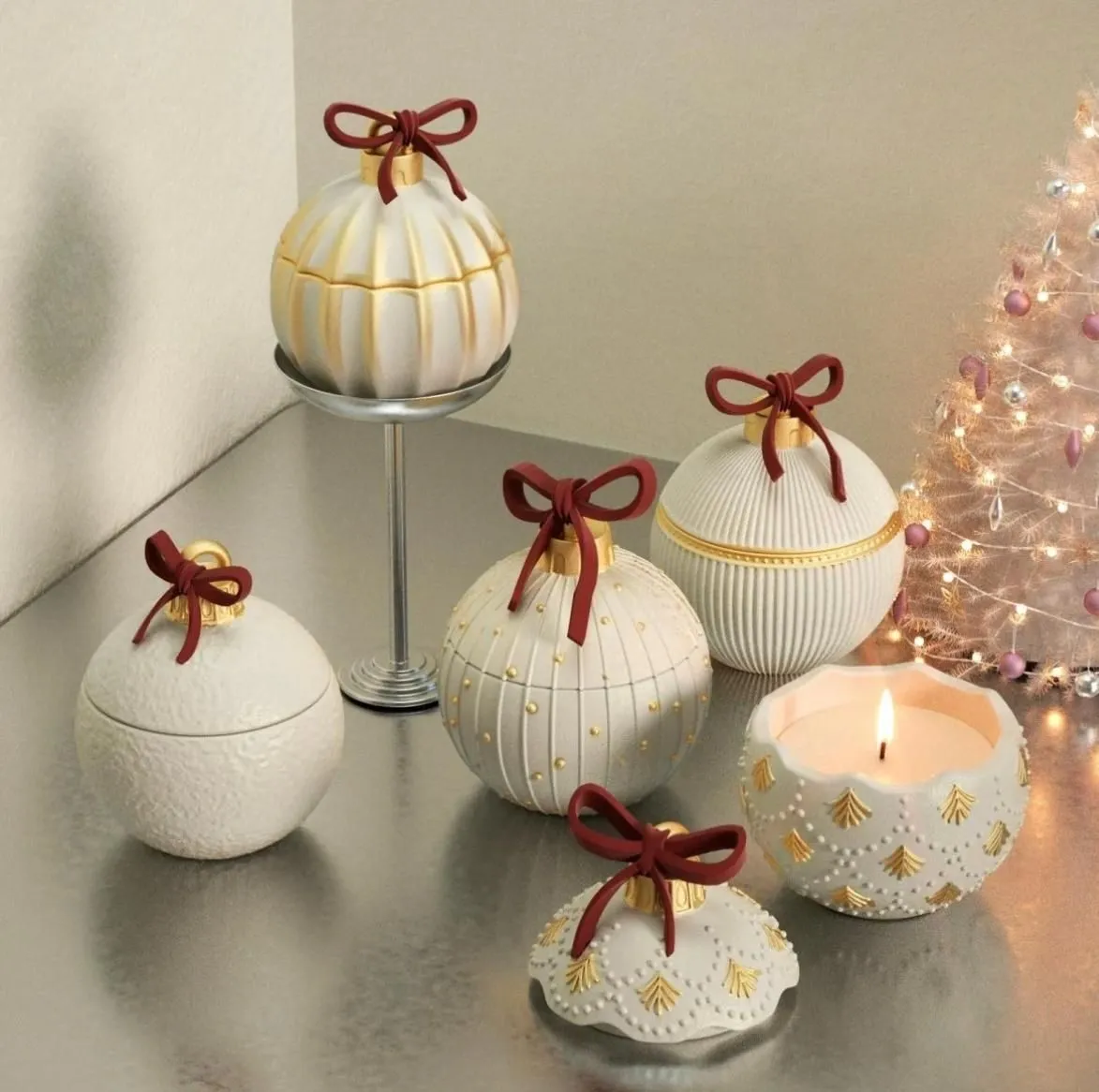 Handmade holiday ornament candles with gold accents and a lit flame